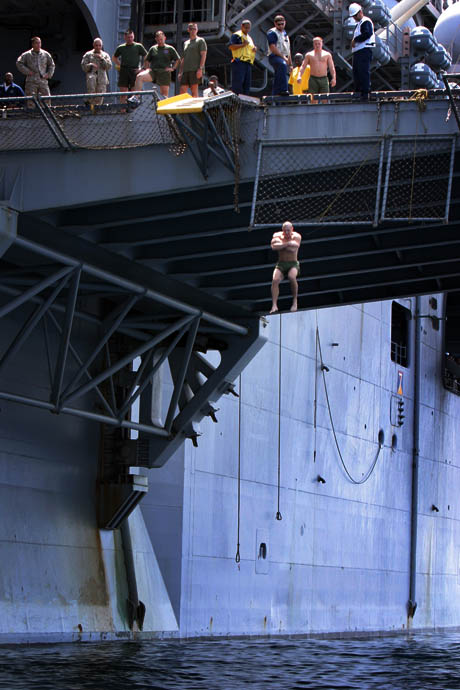2nd Place Stand Alone Photograph by LCpl Jacob W. Chase: A Marine from the 26th Marine Expeditionary Unit jumps about 30 feet from the starboard aircraft elevator of the USS Iwo Jima (LHD-7) during a swim call in the Arabian Sea Oct. 5, 2008. The 26th Marine Expeditionary Unit and ships of the Iwo Jima Strike Group are currently conducting security and stability operations in Central Command Area of Responsibility.