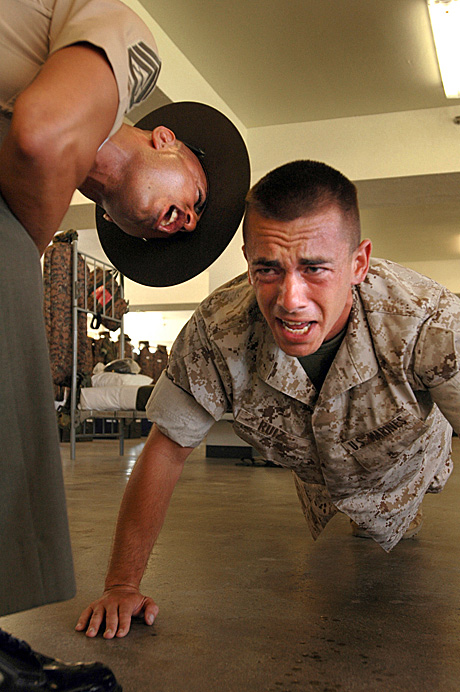 Open Photography 2nd Place - Cpl. Carrie C. Ruiz:  Recruit Dustin Ruiz, Platoon 1026, Company B, does a push-up during a physical training session led by his senior drill instructor Staff Sgt. Francisco Martinez.