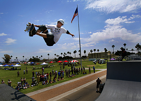 The Megan McClung Sports Photography Award 2nd Place - GySgt. Bill Lisbon: Professional skateboarder Matt Moffett catches air above onlookers at the air station’s Health and Safety Fair Friday during one of three extreme sports shows. The event attracted more than 1,000 station personnel and families. Besides the entertainment, information and demonstrations of dozens of the station’s health, safety and wellness programs were provided.